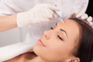 Woman receiving facial injections