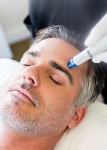 Man undergoing the HydraFacial procedure